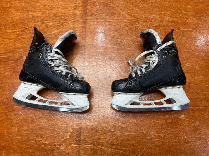 Used Senior Bauer Supreme UltraSonic Hockey Skates Regular Width Pro Stock 8.5 with shot blockers.