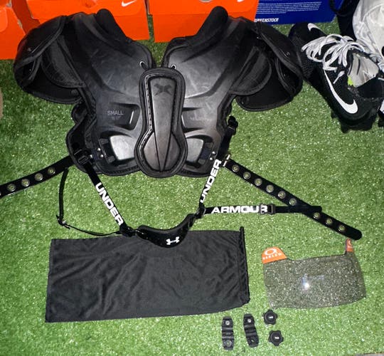 Small Adult Xenith Velocity 2 Shoulder Pads (Used), Oakley legacy tinted visor, and UA chinstrap