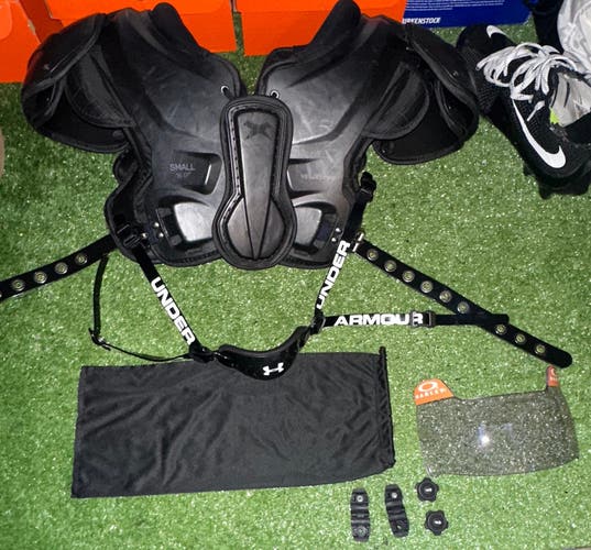Small Adult Xenith Velocity 2 Shoulder Pads (Used), Oakley legacy tinted visor, and UA chinstrap