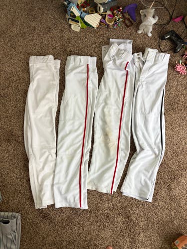 4 pair of White Youth Large Champro Baseball Pants (Used)