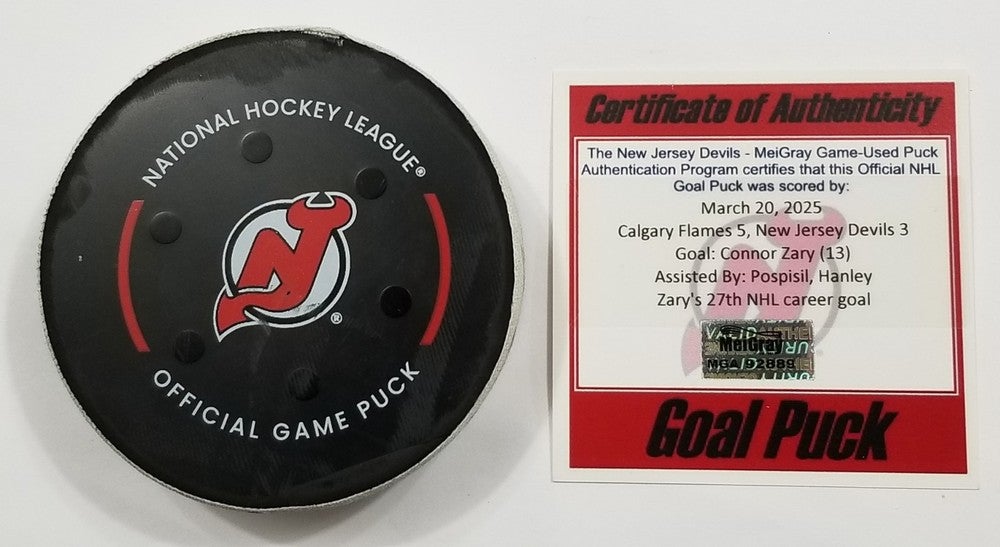 3-20-25 CONNOR ZARY Calgary Flames @ New Jersey Devils Game Used NHL GOAL Puck