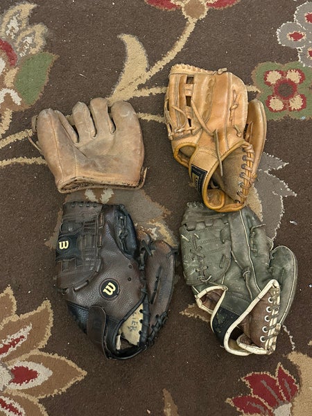 Four Used Right Handed Baseball Gloves