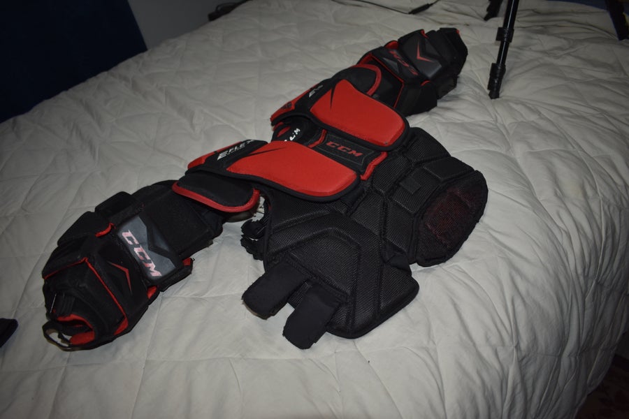 CCM Extreme Flex E1.5 Goalie Chest Protector, Black/Red, OSFA Youth