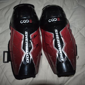 SherWood Code Hockey Shin Pads, Black/Red, Youth 10 Inches