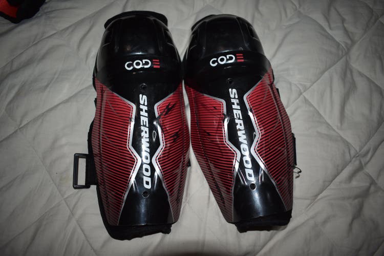 SherWood Code Hockey Shin Pads, Black/Red, Youth 10 Inches