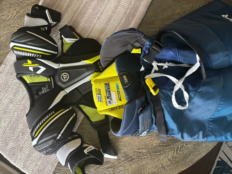 Small / Medium Intermediate Warrior ALPHA LX PRO Shoulder Pads (Used)