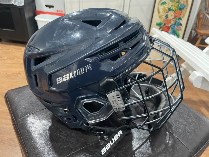 Medium Bauer Re-Akt 155 Helmet (Used like new) with Oreo cage