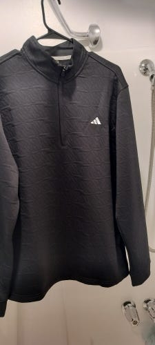 This is an Adidas DWR (Durable Water-Repellent) Quarter-Zip Golf Pullover in black.