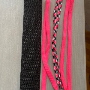 Lacrosse Mesh Kit.  Black hard mesh.  Pink shooting strings
