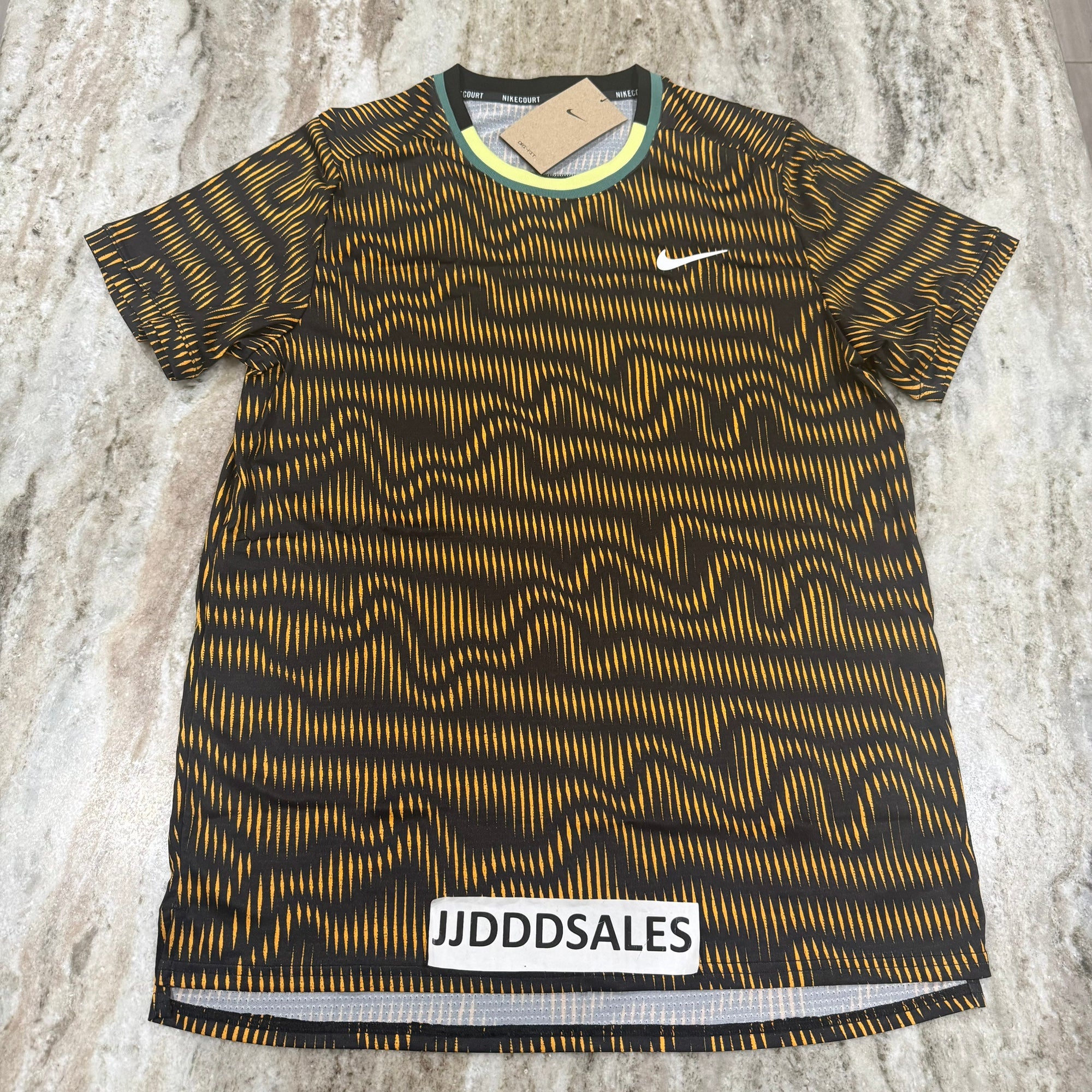 yellow nike tennis shirt