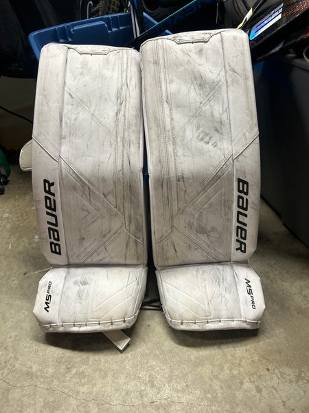 Small Bauer Supreme M5 Pro Goalie Leg Pads (Used) little peice on the bottom of the pad ripped