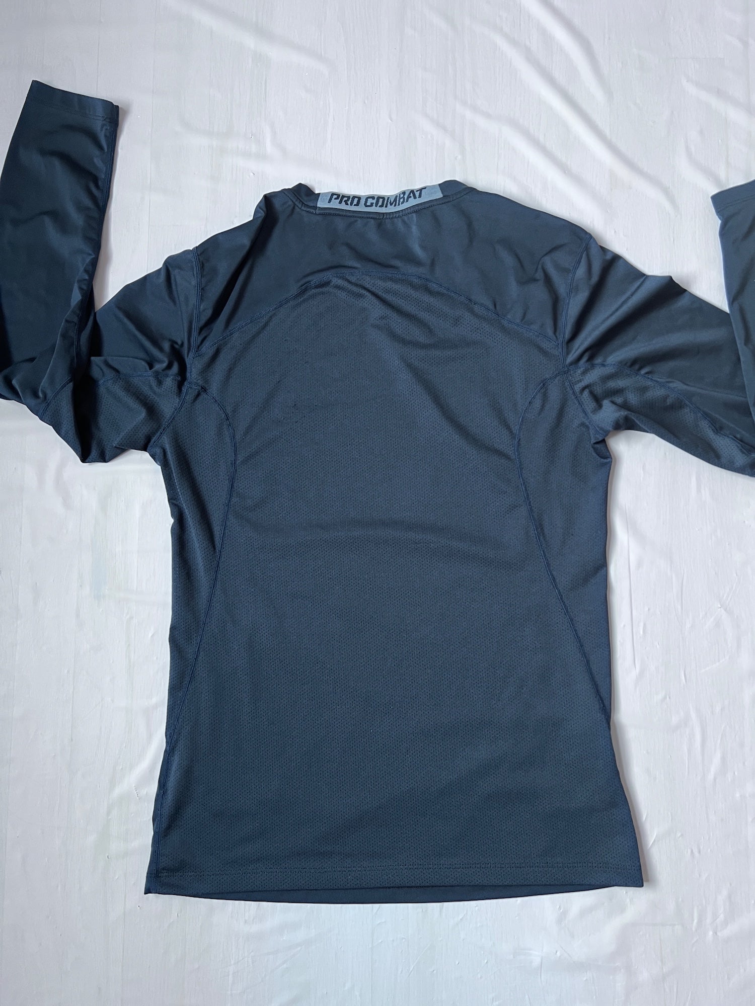navy blue nike compression shirt