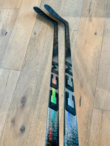 Two CCM Ribcor Trigger 10 Pros, Intermediate, P29, Left, 65 Flex, Charcoal (New)