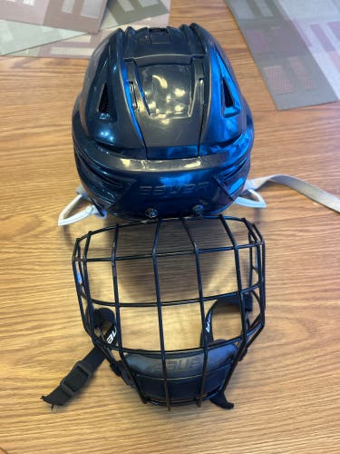 Medium Navy Bauer Re-Akt 150 Helmet with Cage (Used)