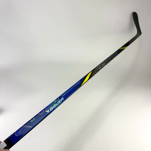 New Left Blue/Yellow Bauer Nexus Tracer | 82 Flex Oates Pro Curve Grip | Schenn | J506