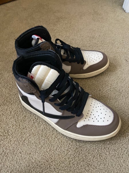 Authentic Travis Scott x Air Jordan 1 Retro High OG “Mocha.”
One of the most iconic and sought-after
