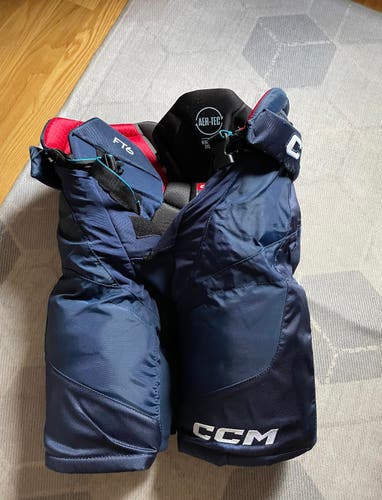 Used Navy Senior Medium CCM Jetspeed FT6 Pro Hockey Pants