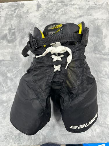 Black Youth Medium Bauer Supreme Ultrasonic Hockey Pants (Used)