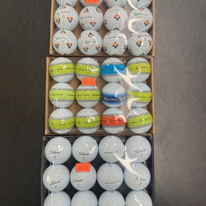 Golf balls-Used A grades by the dozen (like new) Titleist & Taylor made