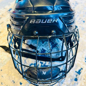Large Black Bauer Re-Akt 150 Helmet with Profile III Titanium Cage