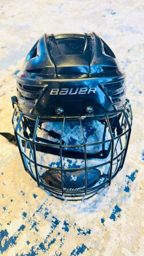 Large Black Bauer Re-Akt 150 Helmet with Profile III Titanium Cage