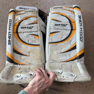 White 24" Youth Sher-Wood 9990 Goalie Leg Pads (Used)