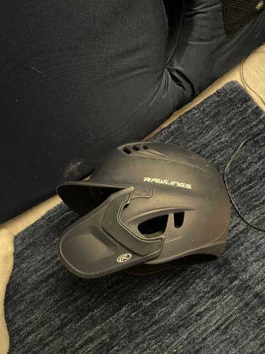 Lightly used Rawlings Batting Helmet Navy With Jaw Guard