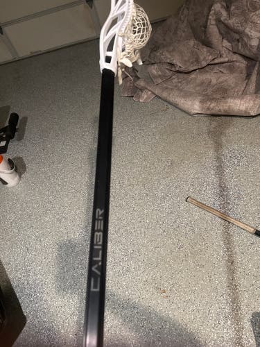Maverik Havok 2 Strung Head on black maverik caliber defense shaft