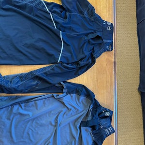 5. Bauer youth medium hockey undershirts with neck guard, plus Howie’s Hockey wrist guards.