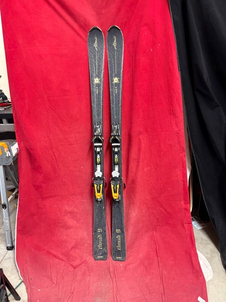 Skis: Atomic Cloud 9 skis, 165cm. Bindings: Atomic, binding Range: 260-370mm