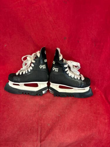 Hockey Skates: CCM Champion 90 ice hockey skates. Size: Kids 12