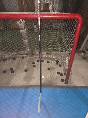 Intermediate Bauer Hockey Stick Mid Pattern 65 Flex Pro Stock (Used)