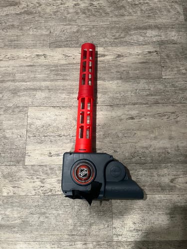 (Used) NHL knee hockey ball launcher