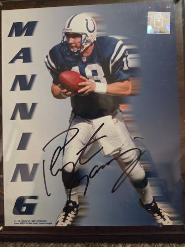 Peyton Manning Autographed picture, rookie card all in the plaque.  COA included!