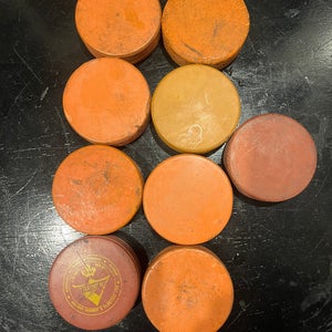 10 Orange 10oz Hockey Pucks (used)