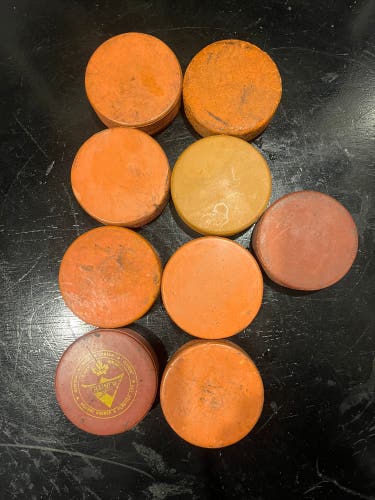 9 0range 10pz Hockey Pucks (used)