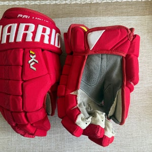 Warrior AX1 Pro Stock Gloves 13" (Used). Carolina Hurricanes