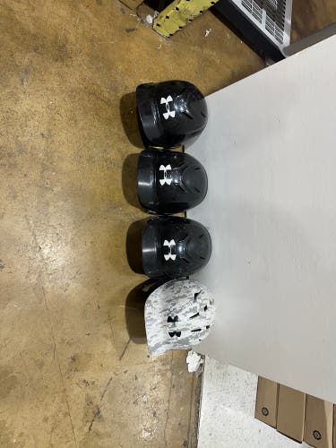 Four Under Armour Batting Helmets