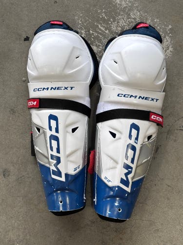 CCM Next 12” Junior Hockey Shin Guards – White/Blue