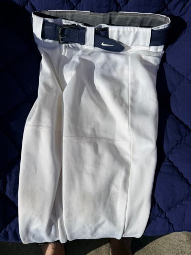 White Men's Medium Youth Mizuno Game Pants with Navy blue Nike belt (Used)