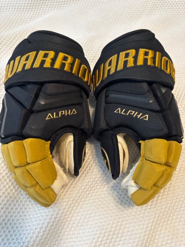 Warrior Alpha Pro 14" Pro Stock NHL Vegas Golden Knights Gloves - Black/Gold