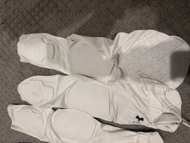 2 White Men's Large Youth Under Armour Game Pants (Used) 1 YL Nike football pants and UA pad shirtYL