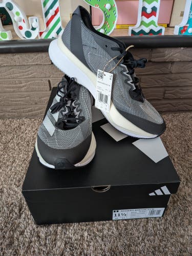 Men's Adizero Boston 12 running shoes, size 11.5