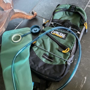 Green and black  Mule camelbak 100oz (Used)