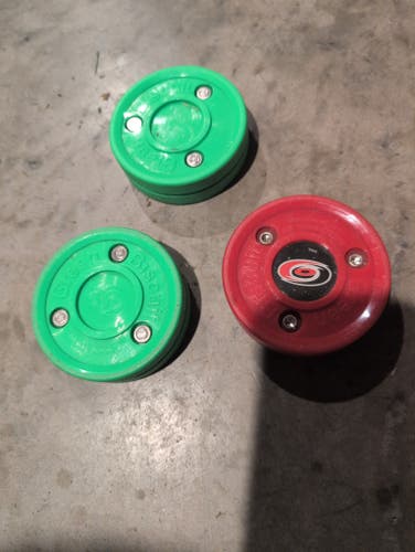 3 green biscuit training pucks (used)