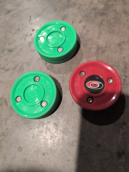 3 green biscuit training pucks (used)