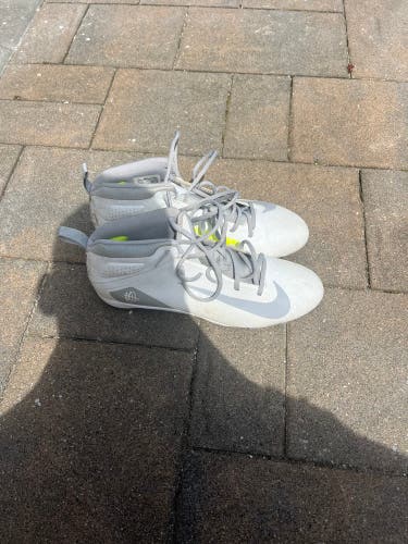 Nike Alpha Huarache 7 Varsity mid-top lacrosse cleats.