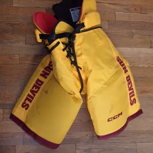 ARIZONA STATE hockey game-worn gold CCM pants worn by Cole Helm in 2023-24