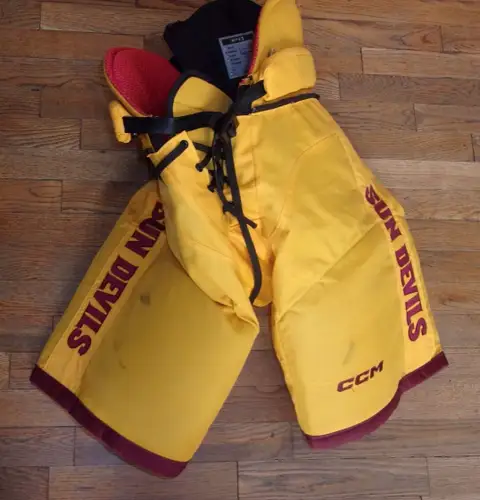 ARIZONA STATE hockey game-worn gold CCM pants worn by Cole Helm in 2023-24