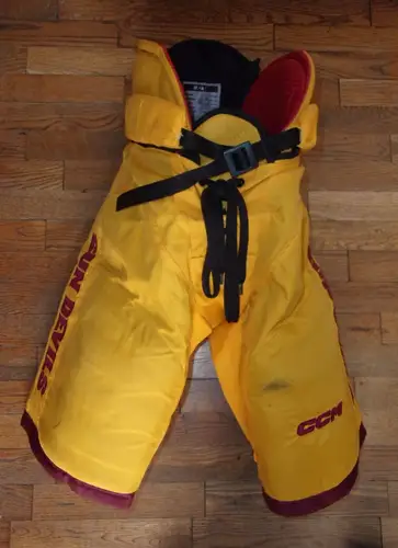 ARIZONA STATE hockey game-worn gold #53 pants worn by forward Ryan Alexander